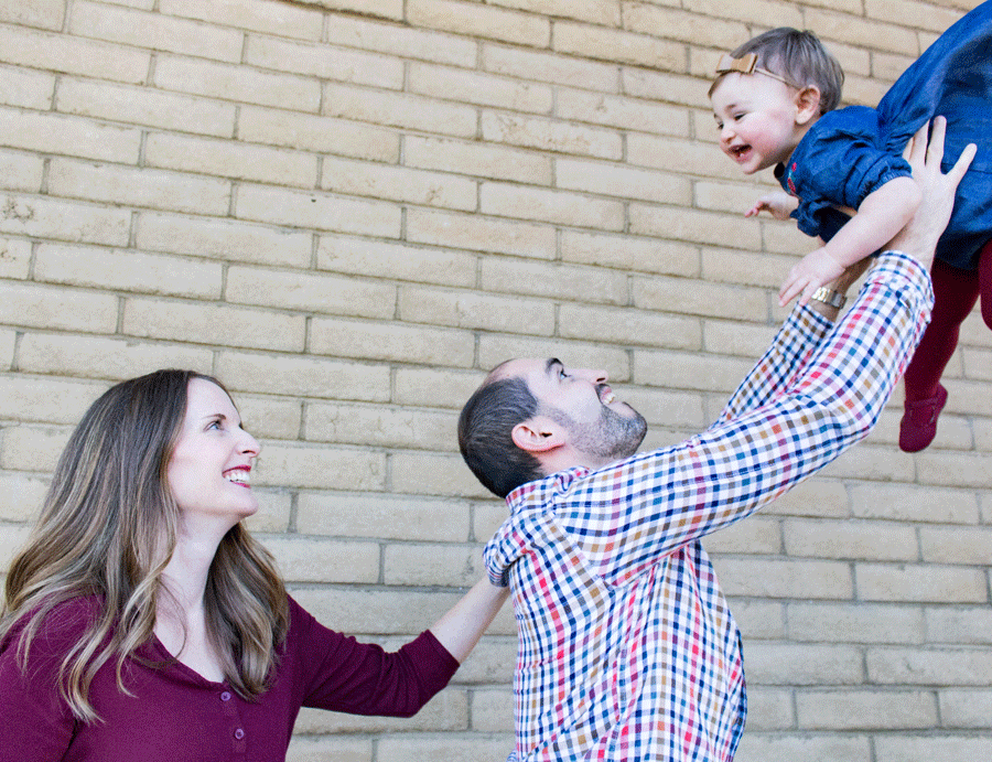 family-photography-daddy-tossing-toddler-in-air-outside