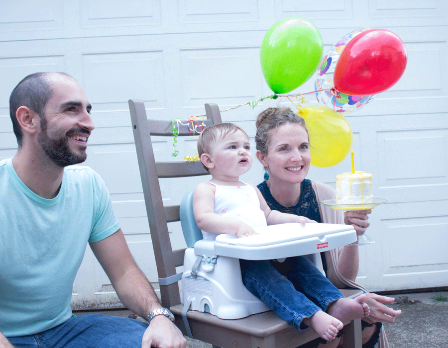 first-birthday-parents-serving-baby-yellow-and-white-cake-photo