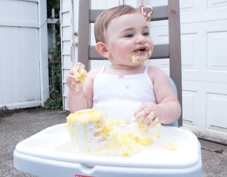 louisa-with-cake-all-over-her-face-highchair