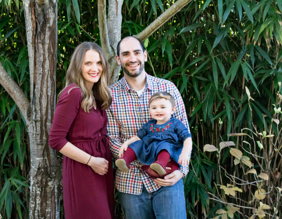pregnancy-anouncement-photography-family-photo-outside-bamboo-backdrop